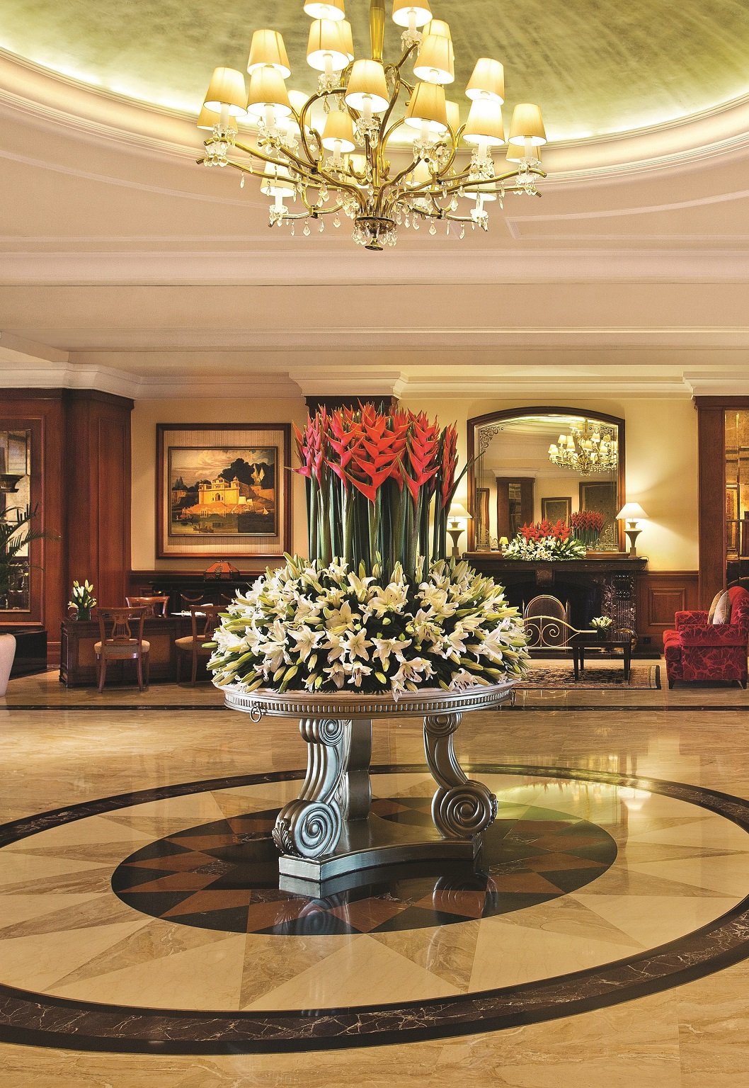 White hotel building with columns at the entrance
